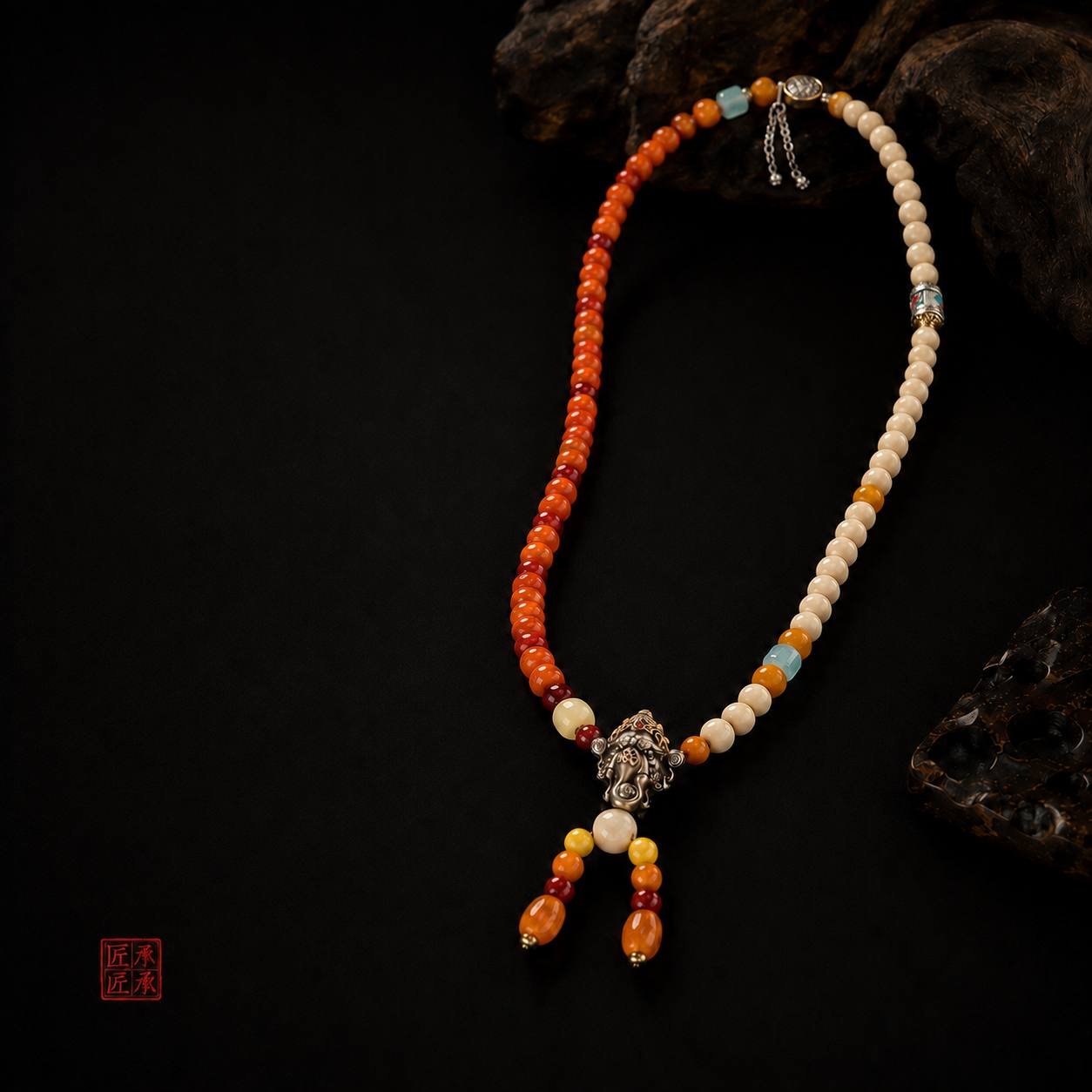 Tingdi bead necklace displayed with dark carved wood accents