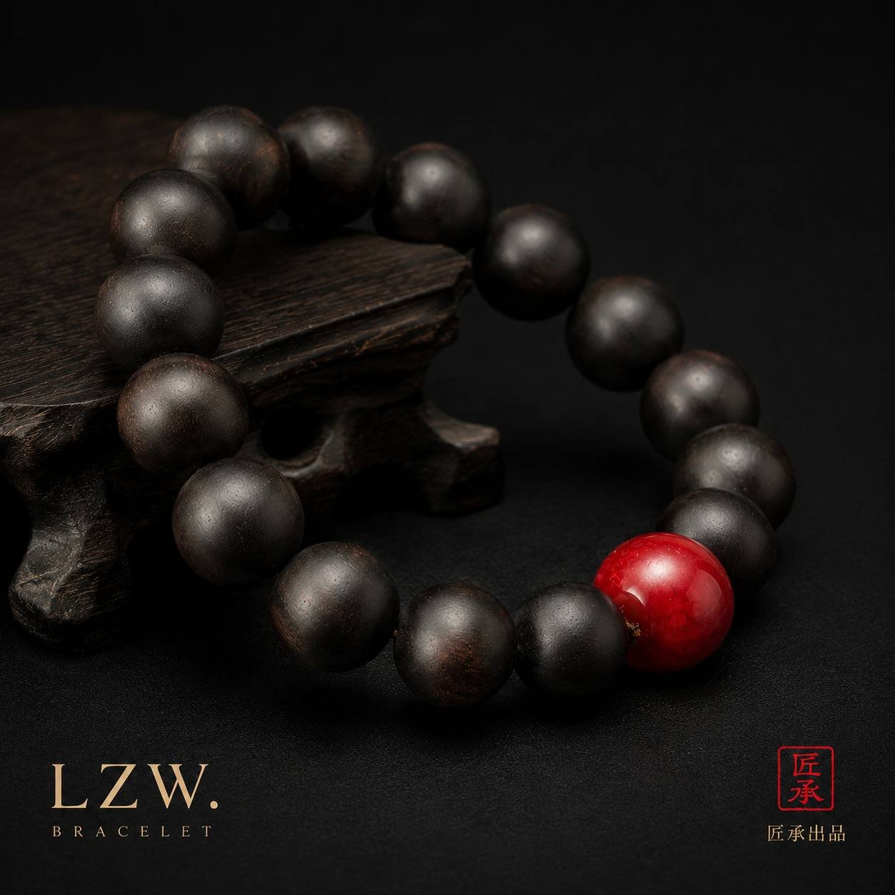 Iron and Crimson black-toned wood bead bracelet beside a carved wooden stand