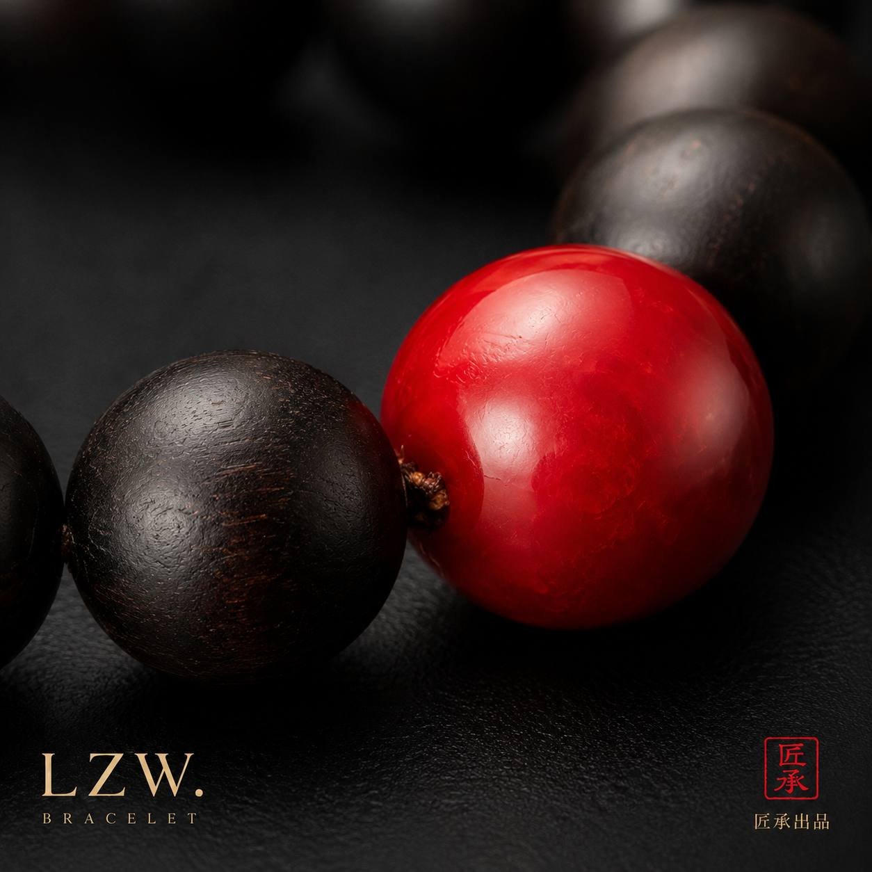 Detail of vivid red focal bead and dark wooden beads on Iron and Crimson bracelet