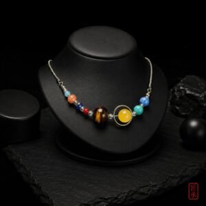 STELLAR ORBIT multi-bead necklace displayed on a black jewelry bust