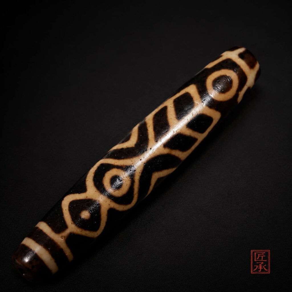 Tibetan Echo Bhutan Double Fish Dzi Bead patterned barrel detail