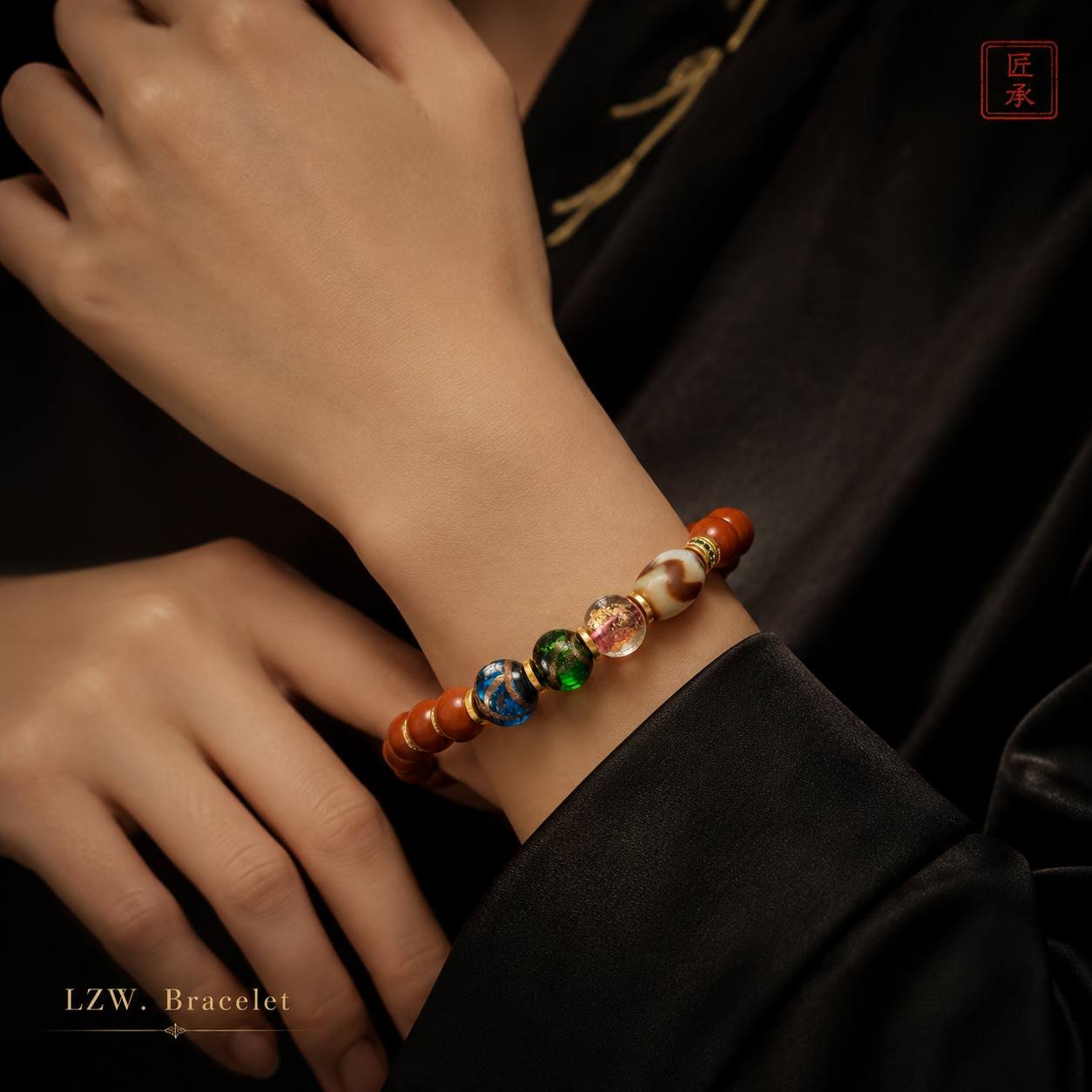 Red Aura bracelet worn on wrist