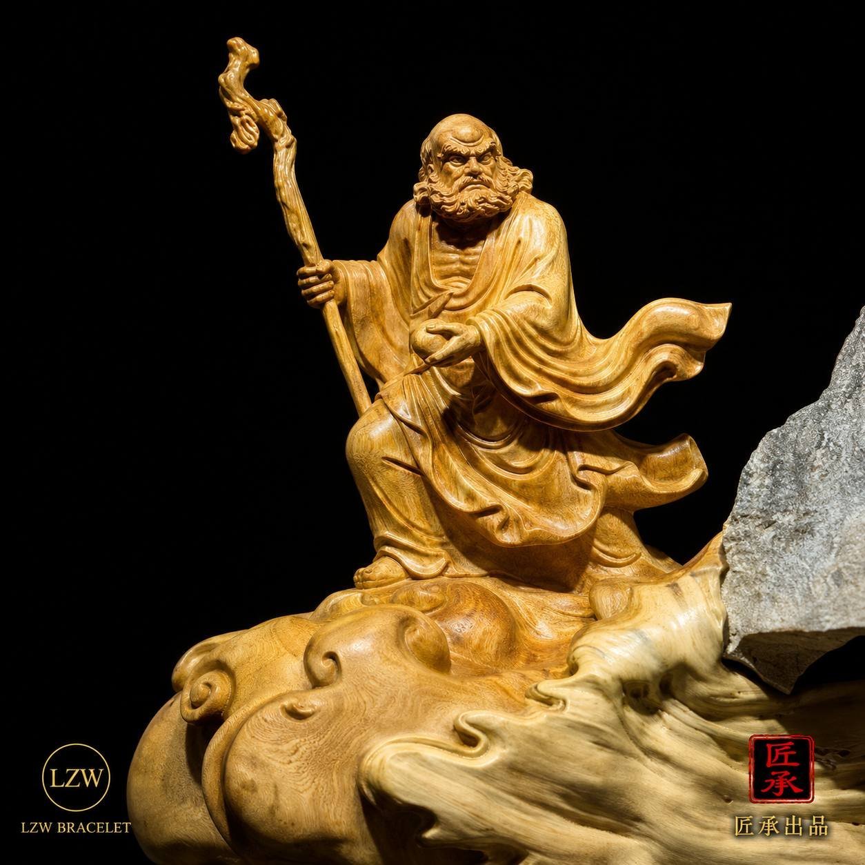 Close-up of Bodhidharma and natural wood and stone details