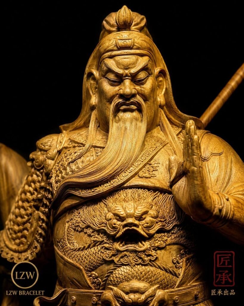 Detailed Guan Yu face and dragon-pattern armor carving
