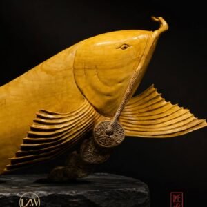 Golden Arowana wood sculpture with flowing fins