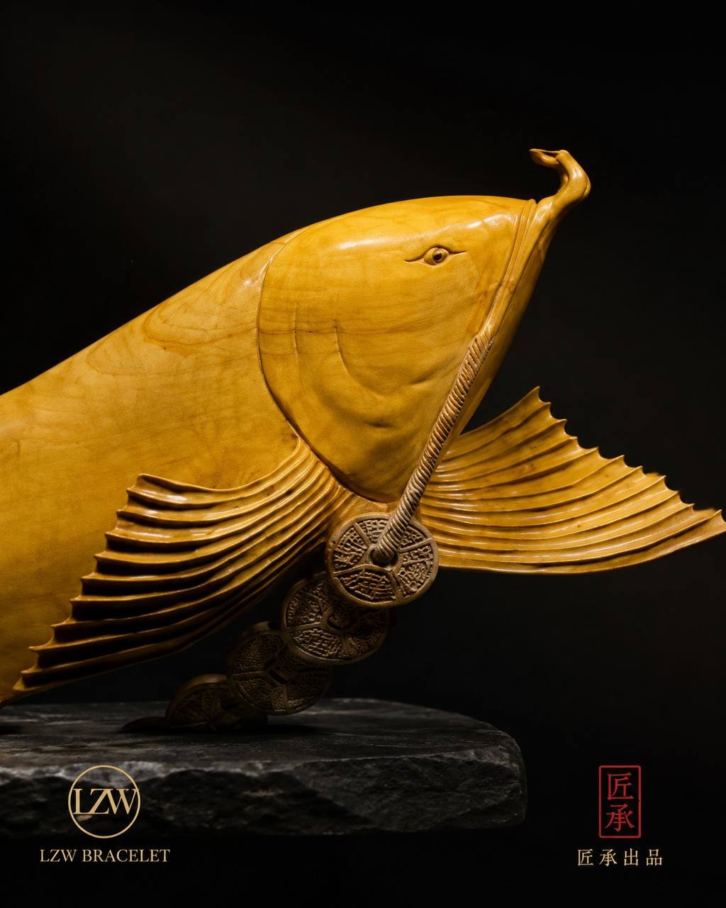 Golden Arowana wood sculpture with flowing fins