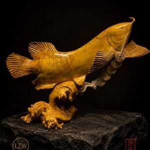 Side view of Golden Arowana wood sculpture