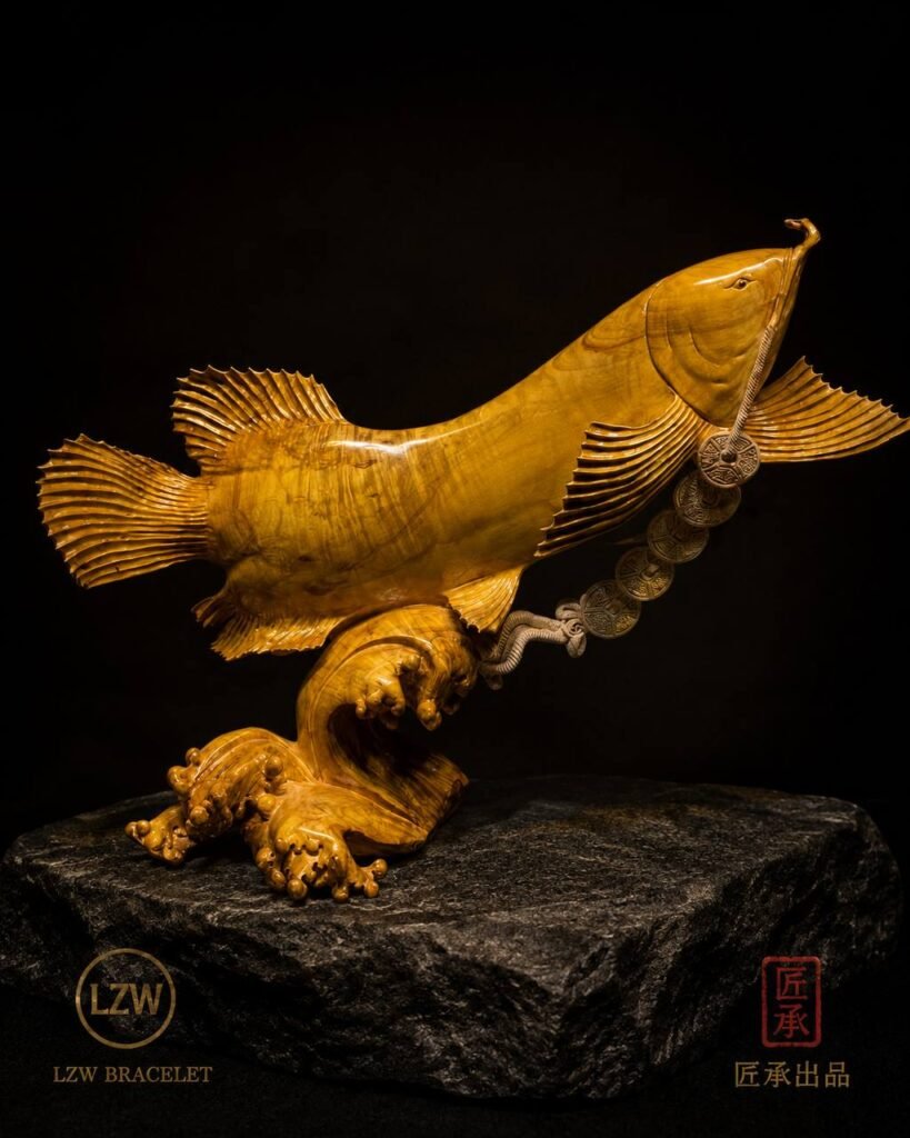 Side view of Golden Arowana wood sculpture