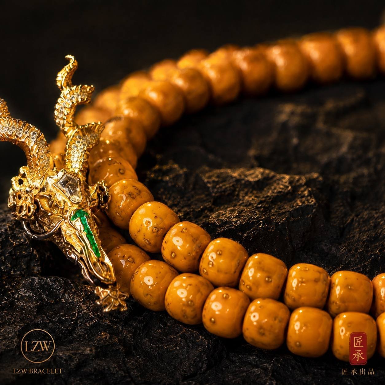Gold-tone dragon pendant on a dark stone background
