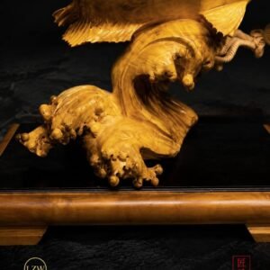 Arowana wood carving with wave-inspired base details