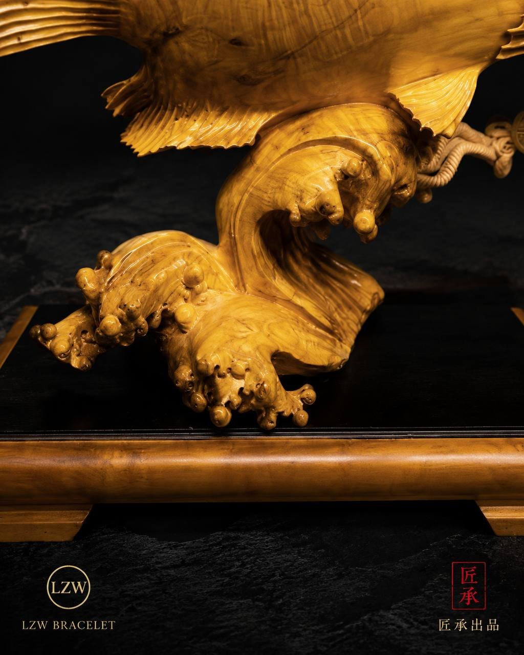 Arowana wood carving with wave-inspired base details