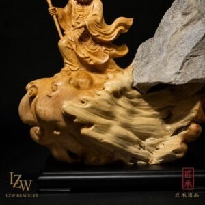 Eastern wood and stone sculpture displayed on a dark base