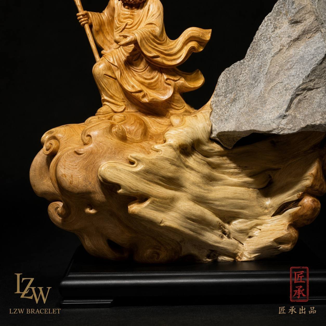 Eastern wood and stone sculpture displayed on a dark base