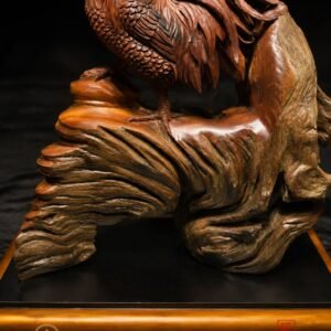 Side view of majestic rooster wood sculpture