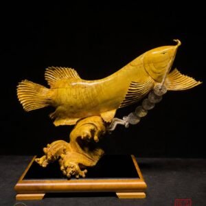Golden Arowana sculpture with spread fins and natural wood grain